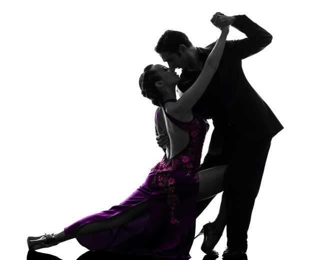 one caucasian couple man woman ballroom dancers tangoing in silhouette studio isolated on white background